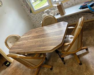 #015 Laminate Table w/4 rolling Chairs and 1 leaf - 42-60x42x29 $125.00