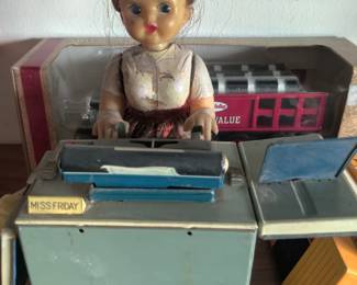 Miss Friday tin toy 