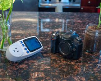 (Left - Power Consumption Meter) (Right - Nikon D50-SR body)