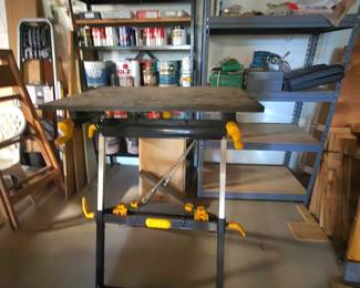 A bit of the basement workshop. Lots of tools, hardware, wood, dollies, workbenches...