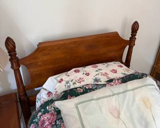 Vintage-style cherry twin bed with acorn-shaped finials