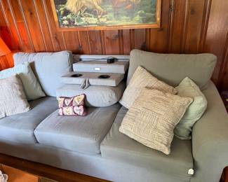 Sofa with fold down middle cushion