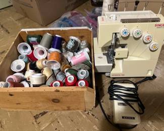 Singer sewing serger & spools of thread