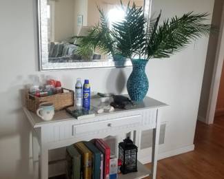 Foyer table; large mirror; books