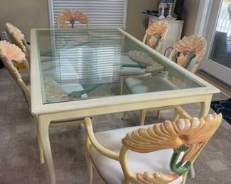 Sculptural dining set seats 6; carved wood dining set in the manner or style of Phyllis Morris, featuring distinctive lotus or floral-carved chair backs and a glass-top table