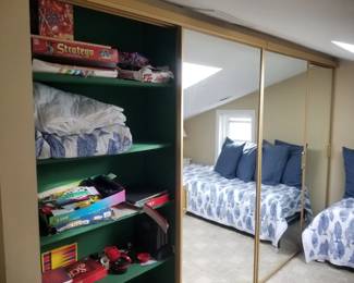 Mirrored closet doors; board games
