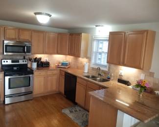 Kitchen is C-shaped with ample cabinets