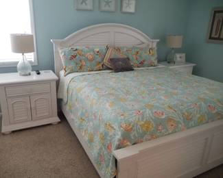 Coastal chic queen bedroom suite: queen bed; nightstands; table lamps