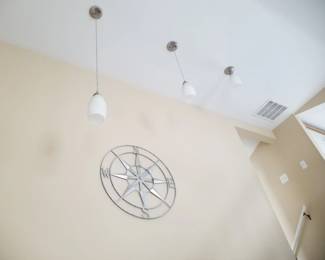 Pendant lights; metal compass wall decor