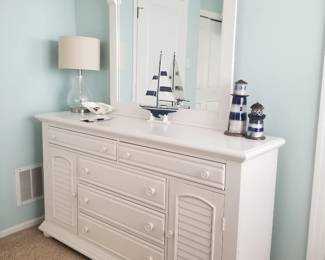 Elegant white dresser with mirror; table lamp
