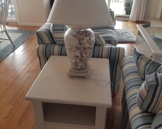 End table; shell-filled table lamp