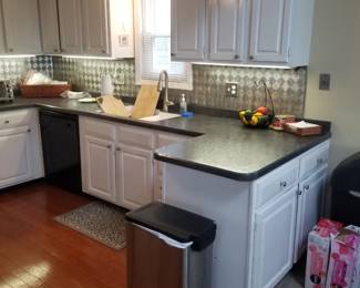 Kitchen is C-shaoped - plenty of cabinets. Step trash can