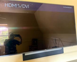 75" Samsung smart TV shown with Sonos Bar