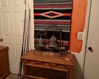 Hawkey Rug, rustic pine chest of drawers, fishing poles, Mission bells