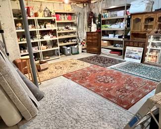 UNFINISHED BASEMENT WITH MORE RUGS