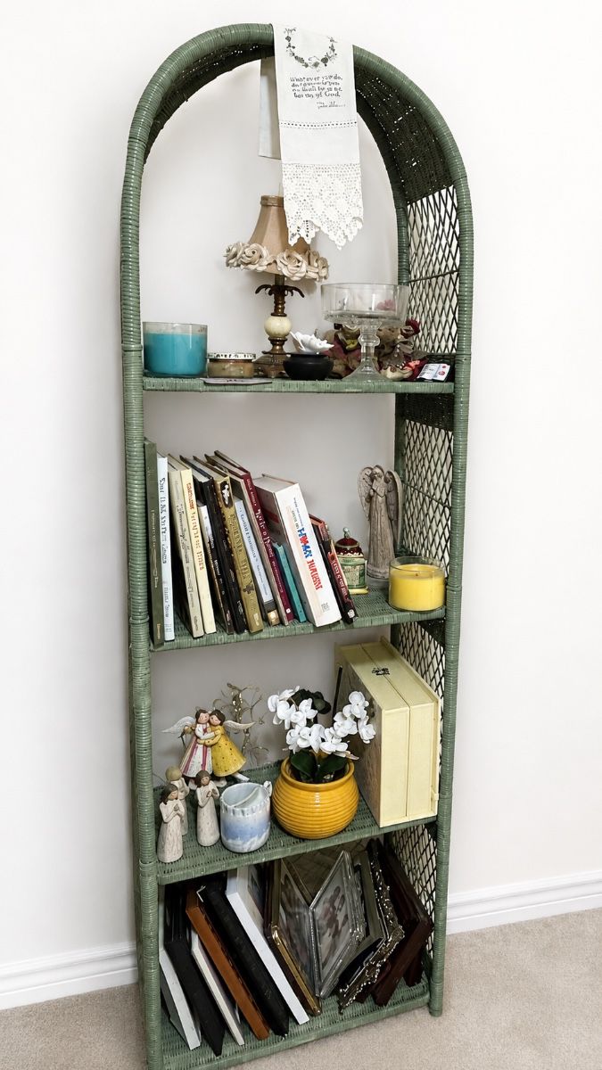 vintage arched green wicker/rattan bookcase features a distinctive rounded dome top and 4 open display shelves.