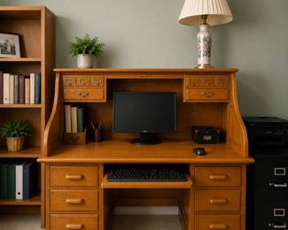 classic solid oak roll-top computer desk with a warm honey finish, multiple small organizer drawers, and a pull-out keyboard tray. With both sides on top that pull out alsoNicest size and condition I have ever found