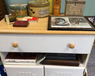 White and blonde wood cupboard with drawer and doors below 