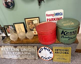 Signs, tins, glass lamp shades for the hanging light fixture 