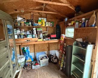 With gardening supplies, cabinets, shelves etc