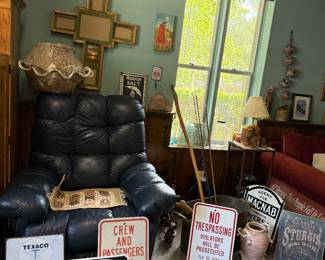 Signs, birch bark pot, dark blue oversized leather recliner
