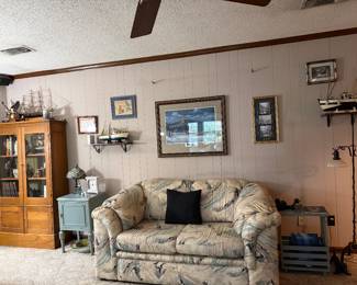 Matching love seat, lots of collectibles, books and art