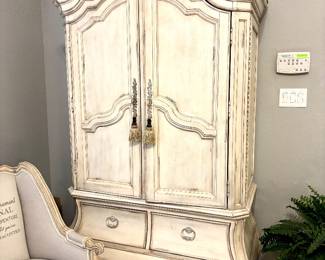 Distressed white armoires