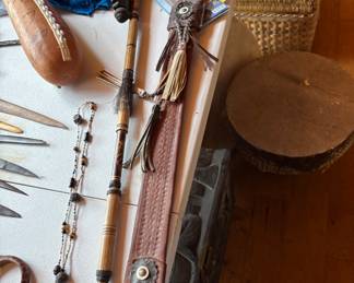 The Blow Dart and the long knife with sheath are the items in auction