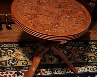 Hand carved table. The other side is a checker board