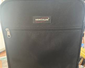 small black suitcase with wheels