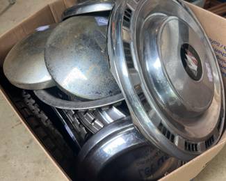 box of many car hub caps