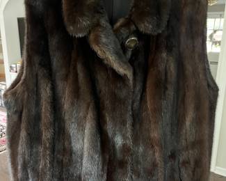 Mink fur vest with large button closure.