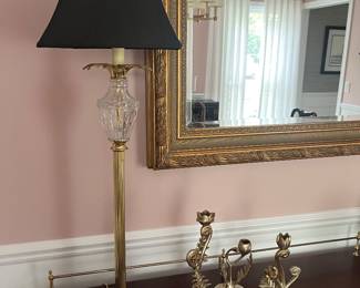 One of two matching Hollywood Regency-style table lamps; three Anthropologie candle holders.