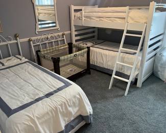 Bunk beds with ladder; twin bed with mattress and box; Graco Pack ‘n Play.