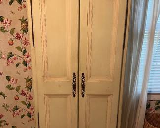 French Provincial-style armoire.
