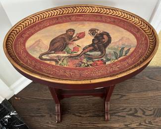 Antique-style tray table featuring two monkeys.