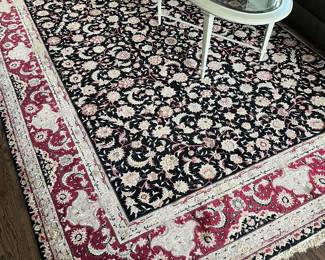 Oriental rig with floral design, approximately 11’ x 9’.