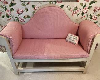 Loveseat/daybed with red and white checked fabric.
