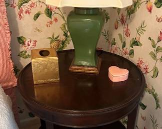 One of two matching round side tables; green, ceramic vase lamp.