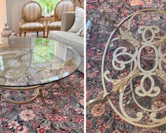 Glass top coffee table with decorative metal base 