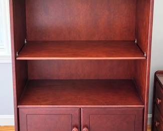Shelf unit with closed storage.  Custom glass added on top shelf.
