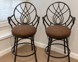 Iron swivel counter stools with cushioned seat by Drexel Heritage. 