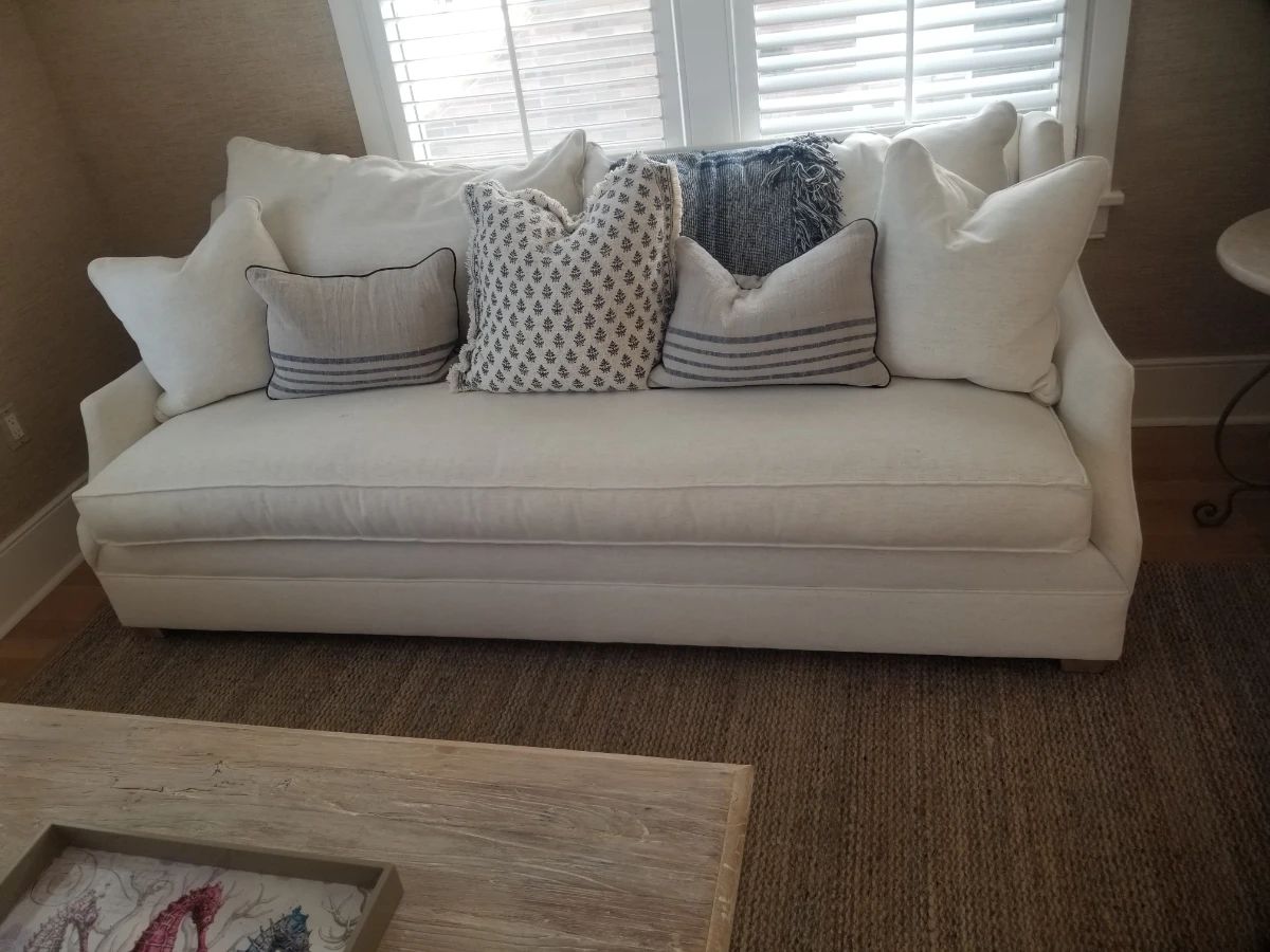 Gorgeous white sofa with an array of throw pillows