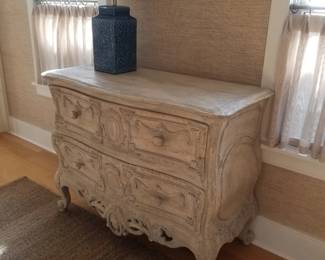 Carved wooden 2-drawer dresser; table lamp
