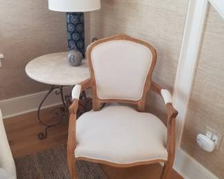 Arm chair - two available; marble top table; table lamp