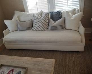 Gorgeous white sofa with an array of throw pillows