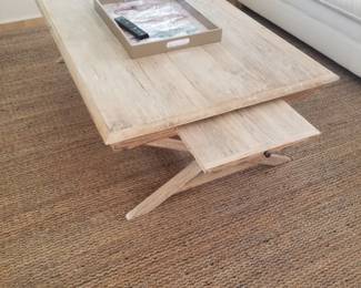 Urban trestle coffee table with pull-out trays; sisal rug