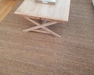 Urban trestle coffee table with pull-out trays; sisal rug
