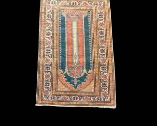 Narrow traditional runner with rust, blue, and ivory geometric design