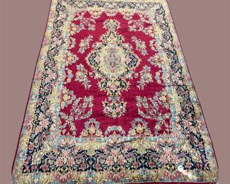 Vibrant red and ivory traditional rug with elaborate central medallion and floral border